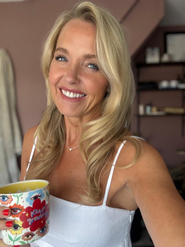 Woman taking a moment for self-care and relaxation, reflecting the importance of making time for wellbeing.